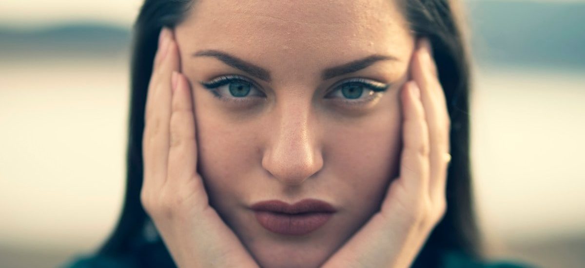 focus photography of woman's face