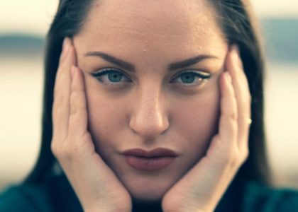 focus photography of woman's face